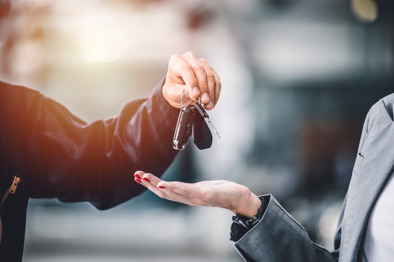 Car keys being handed over