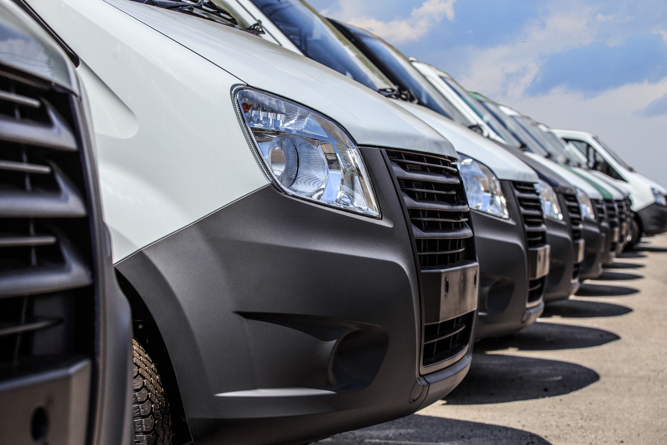 A line of vans parked up